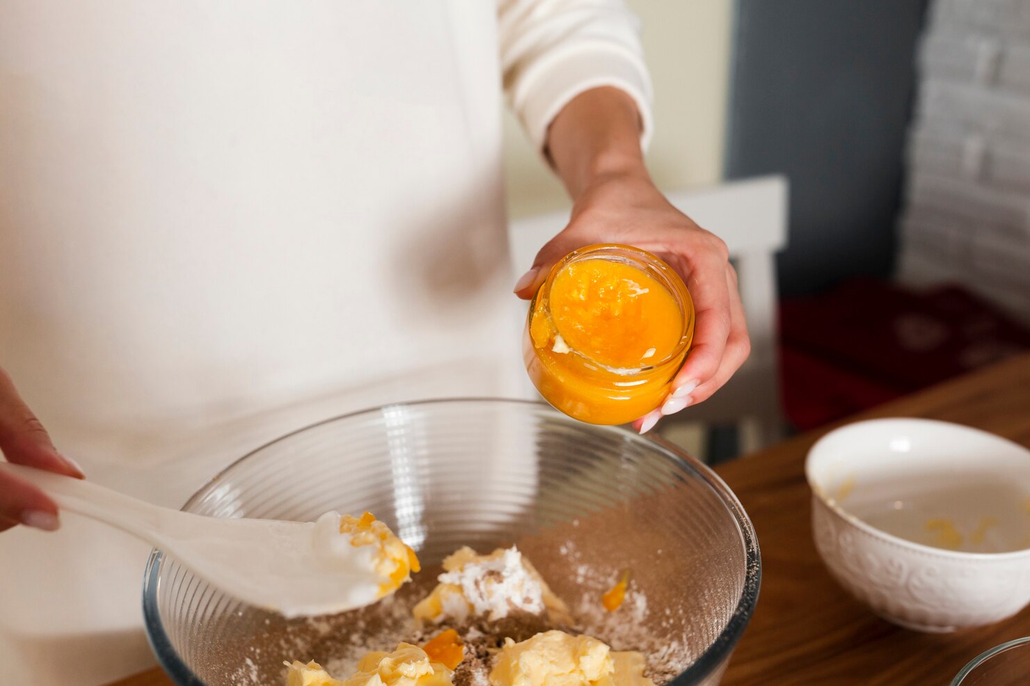 Hands mixing ingredients in bowl for pure ghee home test